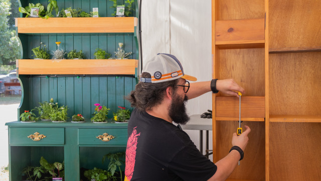 Mak Moktari demonstrating how to turn old furniture into vertical gardens. Justin Lander.